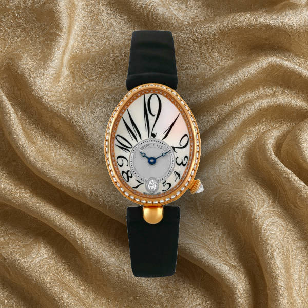 Breguet Reine de Naples women’s dress watch – oval masterpiece with guilloché dial and blue hands, ultimate feminine luxury.