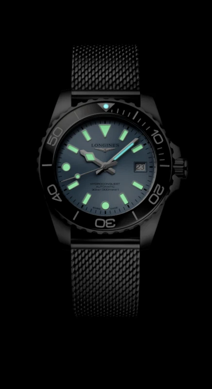 Longines HydroConquest 2026 lume shot in the dark showing glowing hands and markers with Super-LumiNova